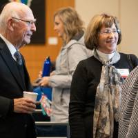 A group of guests talking at the event.